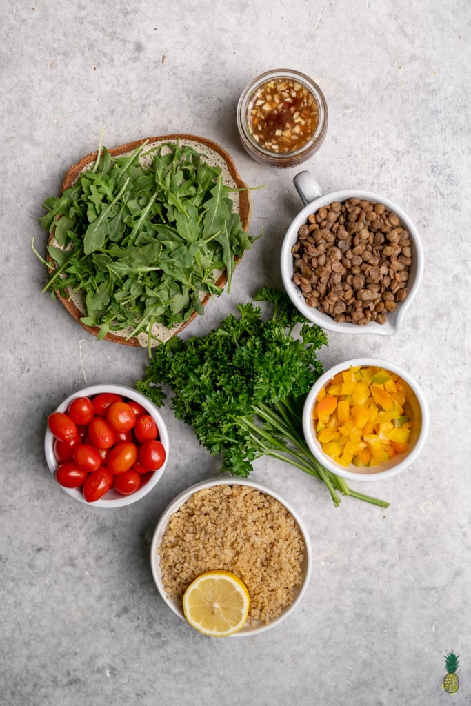 A simple and delicious quinoa, lentil, and arugula salad that is so easy to make and packed with protein! It is perfect to take on the go or enjoy at home! #easy #oilfree #glutenfree #vegan #salad #protein #veganprotein #plantbased #salad #lunch #dinner #entree #togo #onthego #bentobox #mealplan
