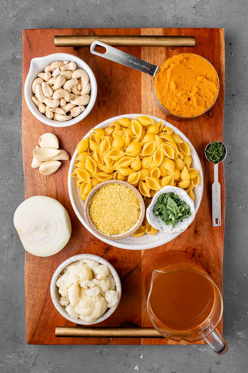 Ingredients for Vegan Pumpkin Pasta on a Wooden Board