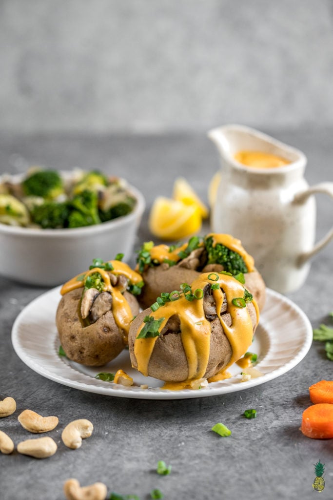 30-Minute Broccoli Cheddar Stuffed Potatoes! Easy time-friendly AND budget friendly vegan meal that is delicious and nutritious! #budget #30minutemeal #cheap #lazy #healthy #oilfree #stuffedpotatoes #vegancheddar #vegancheese #cheesesauce #dinner #lunch #entree
