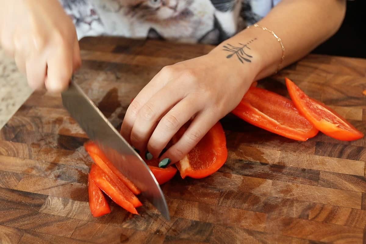slicing red bell pepper for fajitas