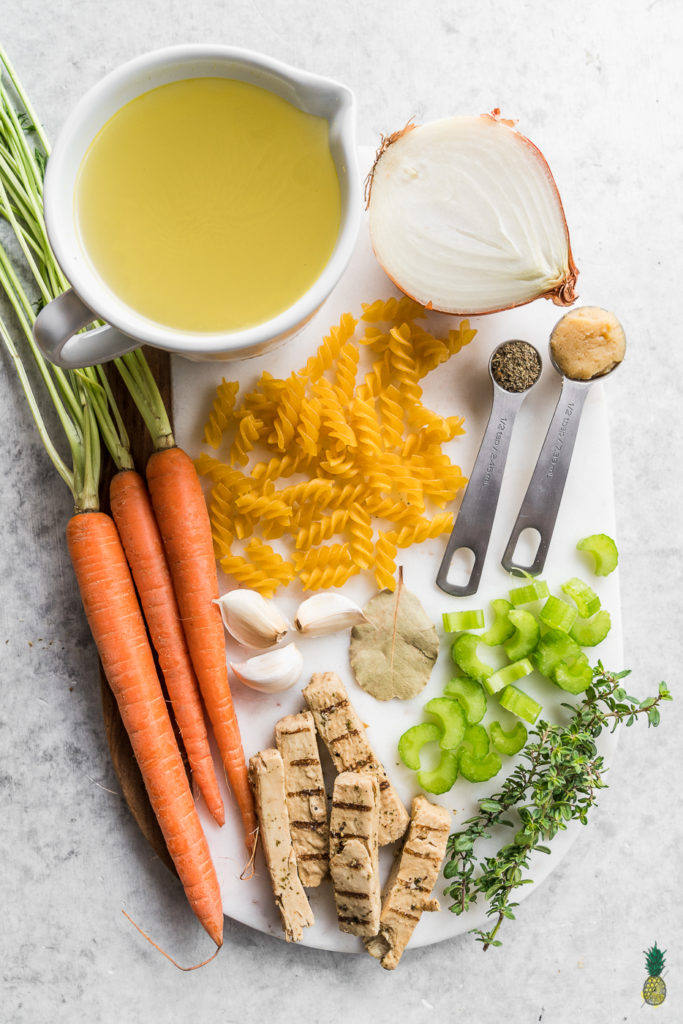 An easy and traditional Vegan Chicken Noodle Soup that is perfect for the cold winter weather and is guaranteed to help you feel cozy! #chickennoodlesoup #veganchicken #veganized #sweetsimplevegan #vegansoup #entree #veganrecipes #easyvegan #simplerecipe