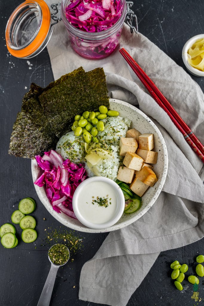 Easy, filling and flavorful vegan sushi buddha bowl-- perfect for vegans and nonvegans alike! #sushi #buddhabowl #vegansushi #veganmeal #entree #veganentree #lunch #dinner #easyvegan #1hourmeal #weeknightmeal #furikake