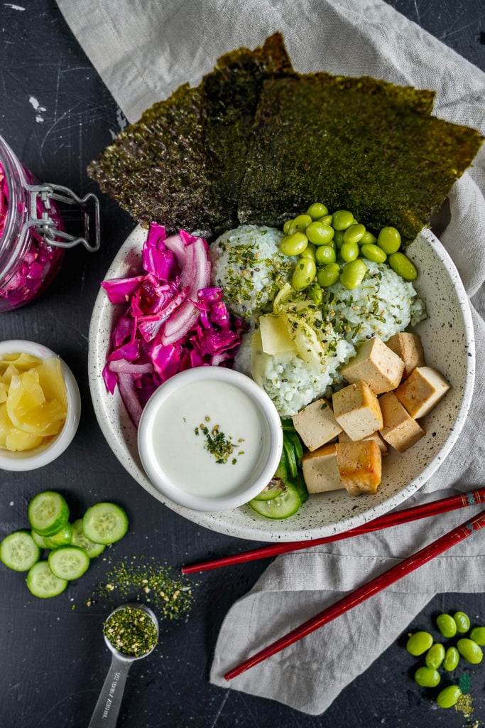 Easy, filling and flavorful vegan sushi buddha bowl-- perfect for vegans and nonvegans alike! #sushi #buddhabowl #vegansushi #veganmeal #entree #veganentree #lunch #dinner #easyvegan #1hourmeal #weeknightmeal #furikake