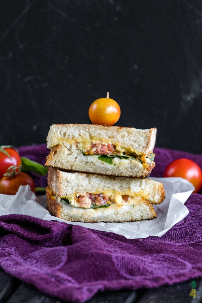 Grilled cheese brought to a whole new level! This vegan caprese grilled cheese will satisfy anyone, vegan or not! It is easy to make, decadent and so dang good! #vegan #caprese #grilledcheese #sandwich #entree #lunch #dinner #vegansandwich #bestvegan #veganized #italian