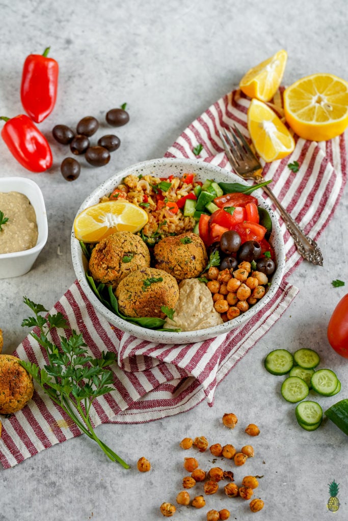 The best buddha bowl rendition yet! This Vegan Mediterranean Buddha Bowl is hearty, nutritionally dense, jam packed with flavor and easy to make! #Vegan #Mediterranean #Buddha #Bowl #entree #veganbowl #easy #lunch #work #onthego #budget #musttry #fresh #falafel #chickpeas #hummus #homemade
