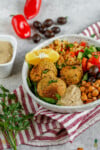 The best buddha bowl rendition yet! This Vegan Mediterranean Buddha Bowl is hearty, nutritionally dense, jam packed with flavor and easy to make! #Vegan #Mediterranean #Buddha #Bowl #entree #veganbowl #easy #lunch #work #onthego #budget #musttry #fresh #falafel #chickpeas #hummus #homemade