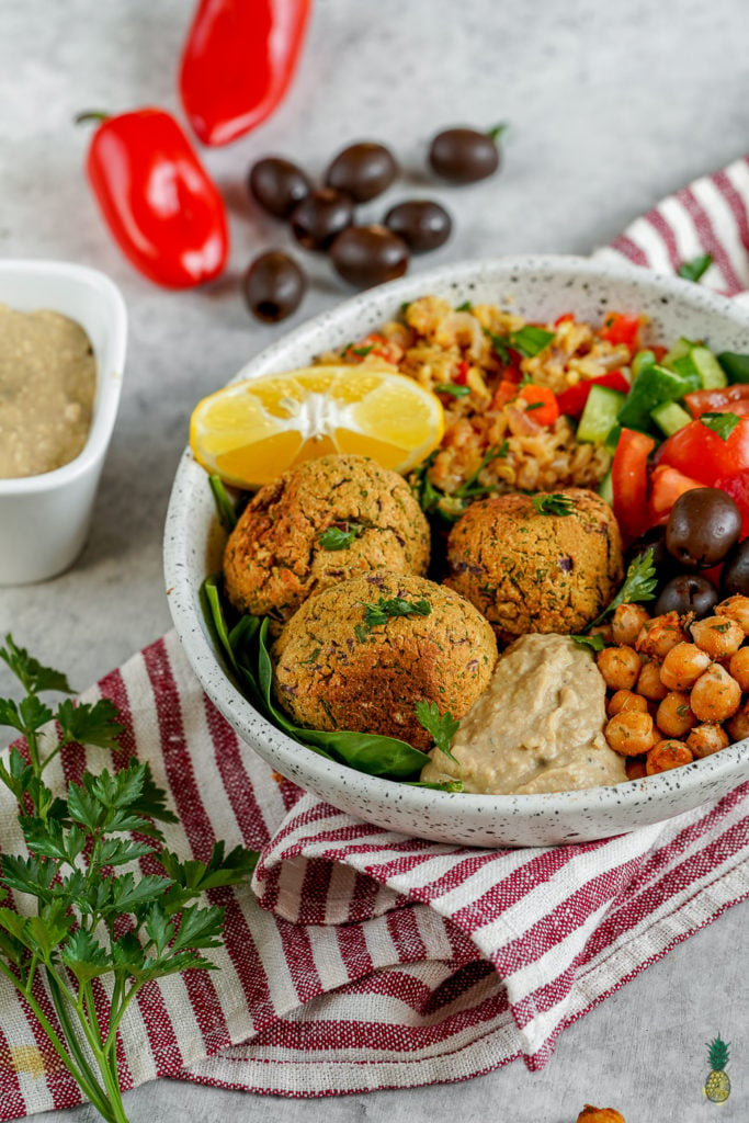 The best buddha bowl rendition yet! This Vegan Mediterranean Buddha Bowl is hearty, nutritionally dense, jam packed with flavor and easy to make! #Vegan #Mediterranean #Buddha #Bowl #entree #veganbowl #easy #lunch #work #onthego #budget #musttry #fresh #falafel #chickpeas #hummus #homemade