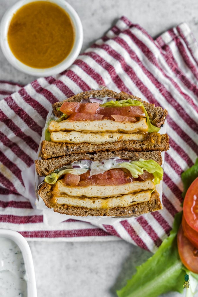 a delicious and easy to make buffalo tofu sandwich with homemade vegan ranch dressing - sweetsimplevegan.com #vegan #sandwich #buffalo #tofu