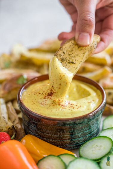 A quick and easy cashew mustard cheese dip made with just 6 simple ingredients. 100% dairy free, gluten free, and soy free, this will be your new go-to dip for every occasion! #cashewcheese #mustard #vegancheese #dip #party #superbowlvegan #sunday #datenight #party #spread #sauce #creamy #entree #side #lunch #sandwich #cheese #dairyfree