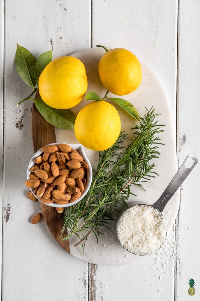 With the perfect balance of tart and sweet, these creamy lemon bars are a must try dessert. They are of course 100% vegan, and also 100% delicious. Plus, they are naturally-sweetened and gluten-free--say whaaaat! #vegan #dessert #lemon #rosemary #mindblowing #sweet #refinedsugarfree #naturallysweetened #medjooldates #coconutoil #unique #musttry #veganized #eggfree #dairyfree #snack #lemonbars