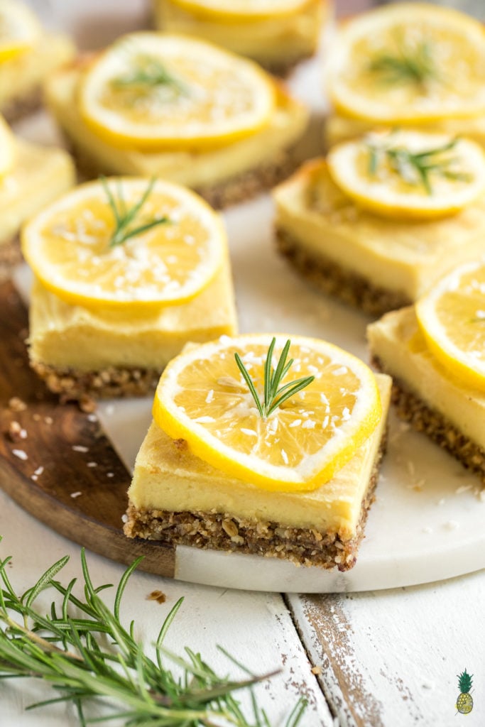 With the perfect balance of tart and sweet, these creamy lemon bars are a must try dessert. They are of course 100% vegan, and also 100% delicious. Plus, they are naturally-sweetened and gluten-free--say whaaaat! #vegan #dessert #lemon #rosemary #mindblowing #sweet #refinedsugarfree #naturallysweetened #medjooldates #coconutoil #unique #musttry #veganized #eggfree #dairyfree #snack #lemonbars