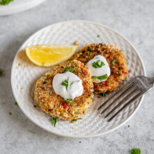 Vegan crab cakes that are wholesome and delicious. Made with hearts of palm, plantains, and artichoke hearts, this unique recipe is sure to be one of your new favorites and is perfect to serve to a crowd! #plantain #crab #vegancrab #veganseafood #easy #veganparty #fried #musttry #easy #lunch #appetizer #side #dip #spread #veganparty #memorialday