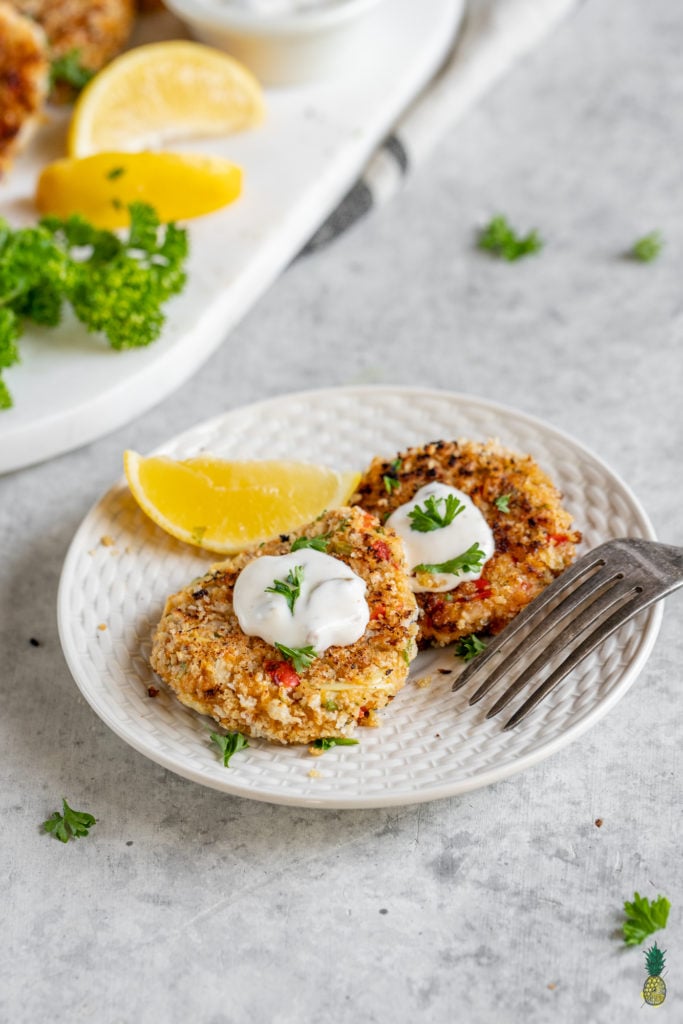 Vegan crab cakes that are wholesome and delicious. Made with hearts of palm, plantains, and artichoke hearts, this unique recipe is sure to be one of your new favorites and is perfect to serve to a crowd! #plantain #crab #vegancrab #veganseafood #easy #veganparty #fried #musttry #easy #lunch #appetizer #side #dip #spread #veganparty #memorialday