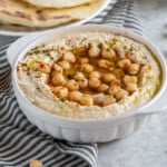 Learn how to make the BEST hummus at home. It is SO easy to make and is better than anything you can find in stores. With just a few simple ingredients and a little bit of patience, you'll be well on your way to a party in your mouth! #hummus #homemade #snack #side #kids #lunch #onthego #healthy #oilfree #musttry #vegan #mediterranean #fresh