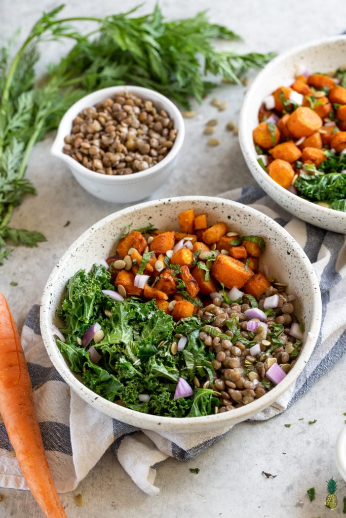A healthy, filling and flavor-packed meal that is perfect for lunch or dinner and is great to take on the go. Filled with tender cumin roasted carrots, lentils, a garam masala-infused vinaigrette, mint, greens and more! #garammasala #greens #lentils #proteinpacked #veganprotein #easyvegan #onthego #lunch #bentobox #underanhour #foolproof #weeknight #leftovers