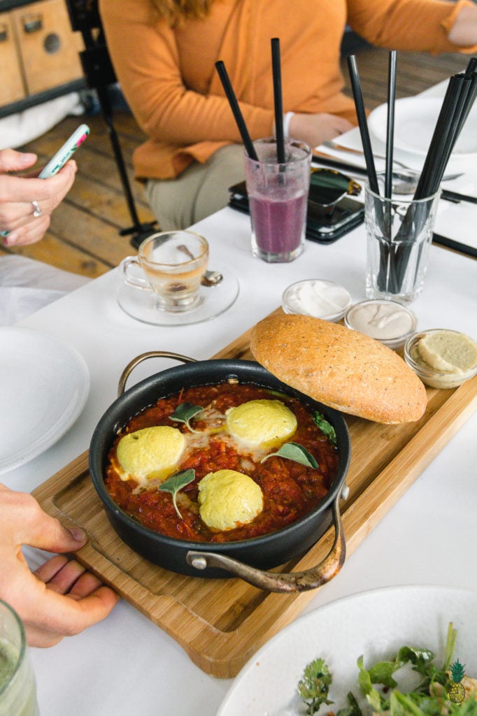 If you haven't had shakshuka before, you are in for a treat! This dish is loaded with a plethora of vegetables in a thick tomato sauce, topped with a flavor-packed tofu scramble, and ready in less than 30 minutes! #shakshuka #breakfast #lunch #dinner #tunisia #middleeastern #northafrica #israel #shakshouka #veganized #egg #tofuscramble #healthy #lowfat #30minute #meal #easy #sweetsimplevegan #entree #onthego #togo