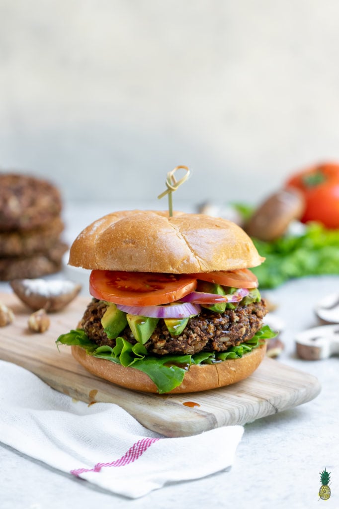 These vegan burgers are easy to make, require simple ingredients and is jam-packed with plant protein. Plus, they are bursting with flavor and are perfect for your next summer party. #veggie #burger #vegan #easy #veganprotein #plantprotein #vegansummer #summerrecipe #party #vegankids #sweetsimplevegan #lunch #dinner #entree