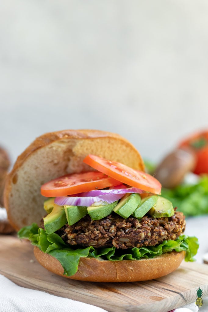 These vegan burgers are easy to make, require simple ingredients and is jam-packed with plant protein. Plus, they are bursting with flavor and are perfect for your next summer party. #veggie #burger #vegan #easy #veganprotein #plantprotein #vegansummer #summerrecipe #party #vegankids #sweetsimplevegan #lunch #dinner #entree