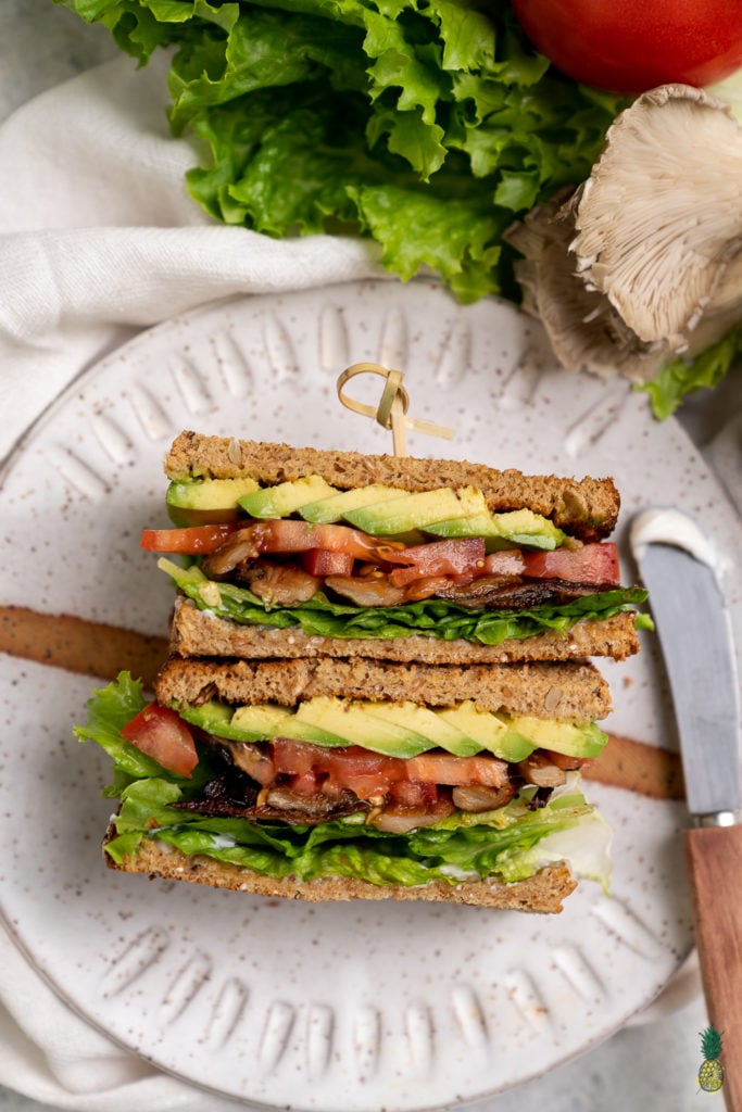 Behold your new favorite sandwich—a quick and easy oyster mushroom sandwich made in just 15 minutes that is packed with flavor and easy to take on the go! #MLTA #BLTA #Vegansandwich #easymeal #lazymeal #veganized #impressivelunch #onthego #musttry #lastminute #partymeal #kidslunch #summer #sweetsimplevegan