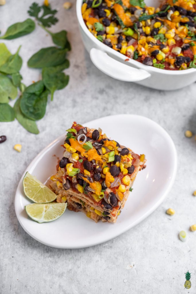 Slice of enchilada casserole on plate. 