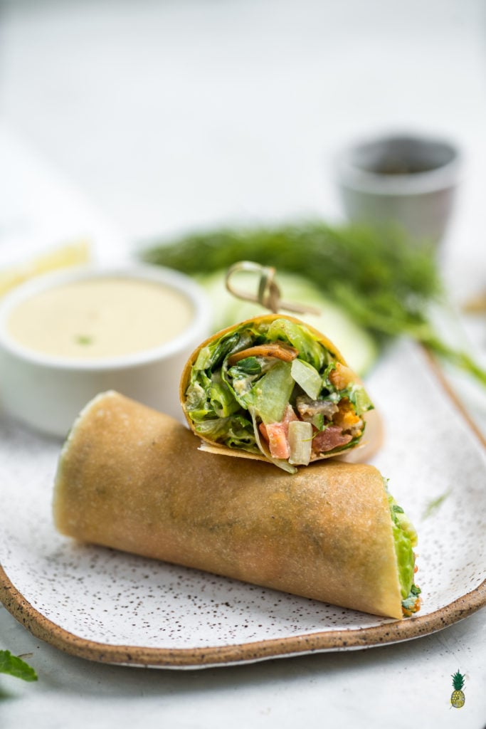 These Caesar salad wraps are the perfect healthy on-the-go lunch to make for school or work. They are light, full of flavor, and packed with nutrition to fuel you through the day! #caesar #salad #homemade #coconutwrap #glutenfree #schoollunch #onthego #vegan #sweetsimplevegan #lunch #entree #togo #lunchbox #easy #filling #cashewcream