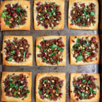 This recipe makes for the perfect appetizer or snack! A delicious tofu "meat" seasoned with fresh onions, sundried tomatoes, parsley, pomegranate molasses, cinnamon, and allspice, and served atop crispy spring roll wrappers. It is the perfect balance of sweet and savory, and the ingredient combination makes for such a fresh and flavorful dish! #tahiniandturmeric #tahini #turmeric #mayihavethatrecipe #cookbook #giveaway #lebanesepizza #armenianpizza #middleeastern #veganized #sweetsimplevegan #snack #appetizer #side