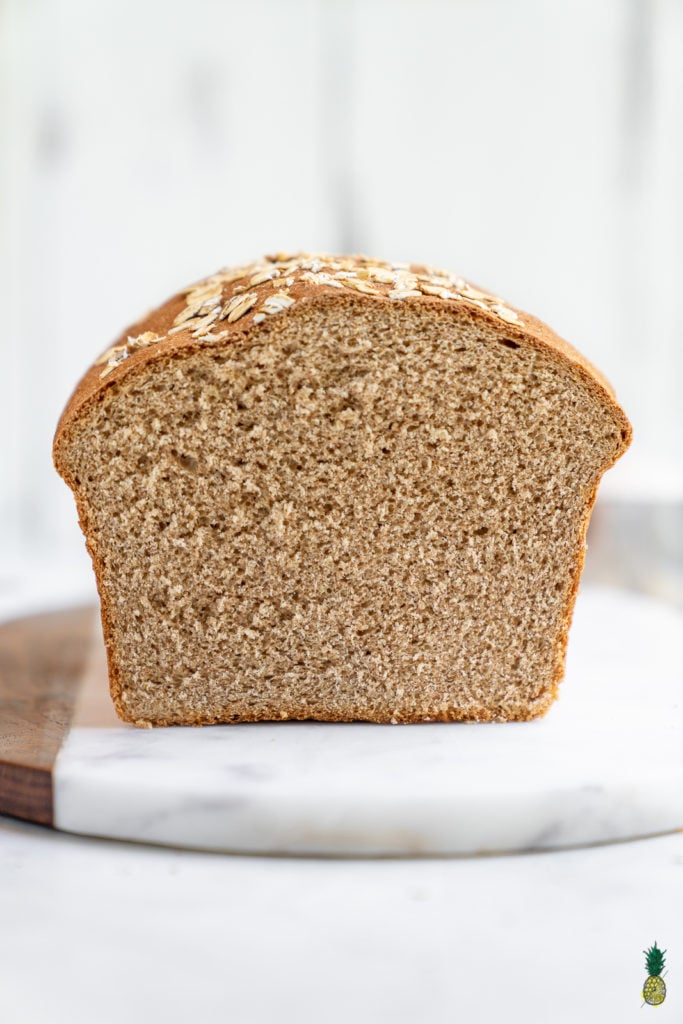 A simple and delicious recipe for the perfect homemade 100% whole wheat bread loaf. It's great for sandwiches, toast, and beyond! #homemade #wholewheat #bread #loaf #sandwich #backtoschool #kids #savemoney #budget #easy #wholegrain 