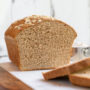 A simple and delicious recipe for the perfect homemade 100% whole wheat bread loaf. It's great for sandwiches, toast, and beyond! #homemade #wholewheat #bread #loaf #sandwich #backtoschool #kids #savemoney #budget #easy #wholegrain