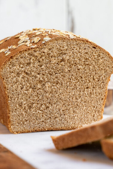 A simple and delicious recipe for the perfect homemade 100% whole wheat bread loaf. It's great for sandwiches, toast, and beyond! #homemade #wholewheat #bread #loaf #sandwich #backtoschool #kids #savemoney #budget #easy #wholegrain