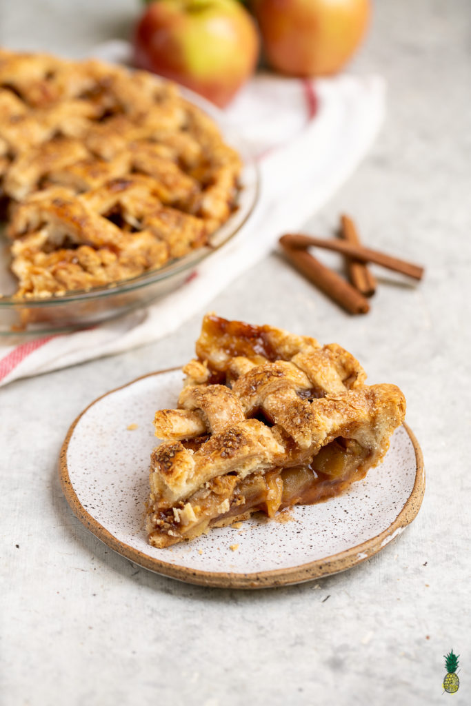A classic holiday dessert, made vegan! This recipe is perfect for fall, easy to make and damn delicious. Instead of vegan butter, the crust is made by using coconut oil, which results in a perfectly flaky pie crust to surround the sweet and juicy apple filling. Get ready to fall in love with this vegan dessert! #fall #dessert #coconutoil #vegan #crust #applepie #easydessert #falldessert #musttry #veganpie #veganfall #side #party #holiday