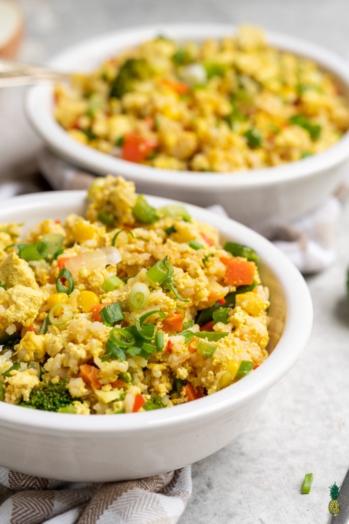 An all vegan egg fried rice that is easy to make, plus is the perfect way to use up any leftover rice you have! It is high in protein, healthy and satisfying, even nonvegans will love it! #vegan #egg #friedrice #highprotein #lunch #dinner #entree #chinese #veganegg #sweetsimplevegan #leftoverrice #howto #foolproof #datenight