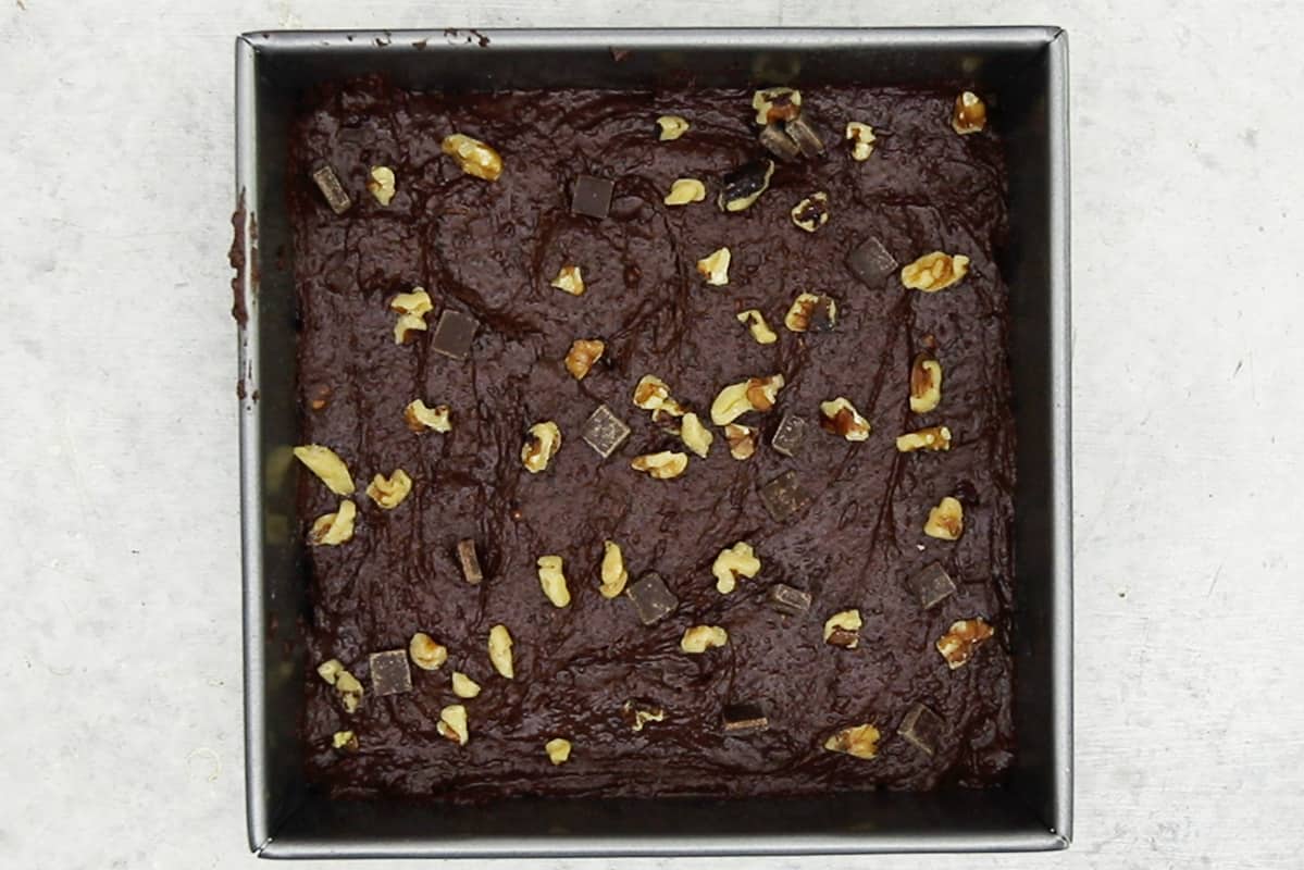 uncooked black bean brownies in metal pan