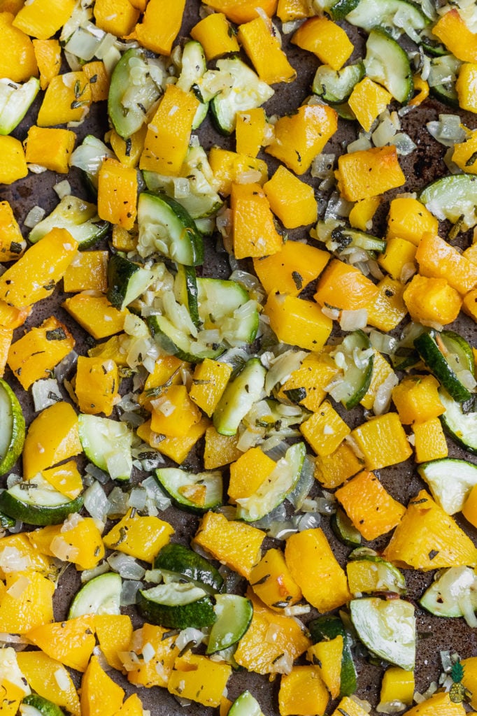 Roasted Pumpkin and Zucchini with Fall Herbs on Pan