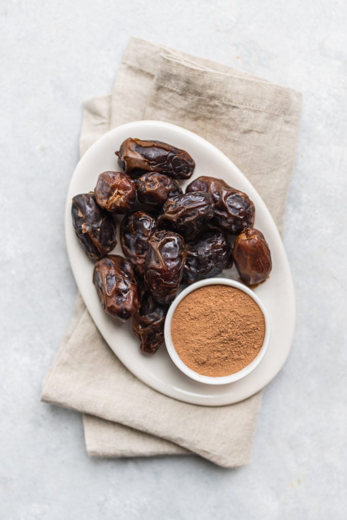 Dates and Cacao Powder on Plate for Truffles