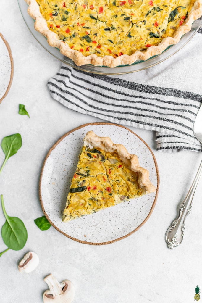 An overhead shot of a slice of vegan quiche on a plate - perfect!