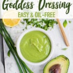 Creamy Green Goddess Dressing in a bowl surrounded by ingredients