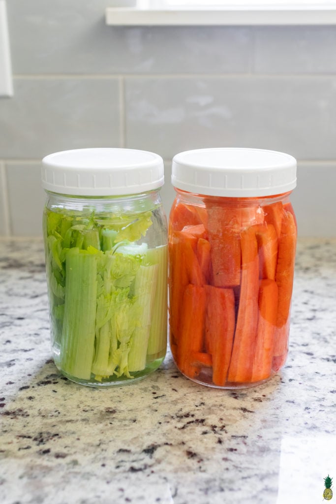 Carrots and celery in jars of water for the refrigerator