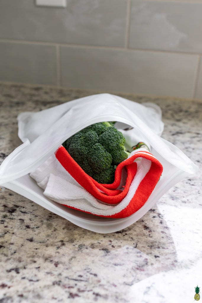 Broccoli in a towel in a reusable bag for the refrigerator