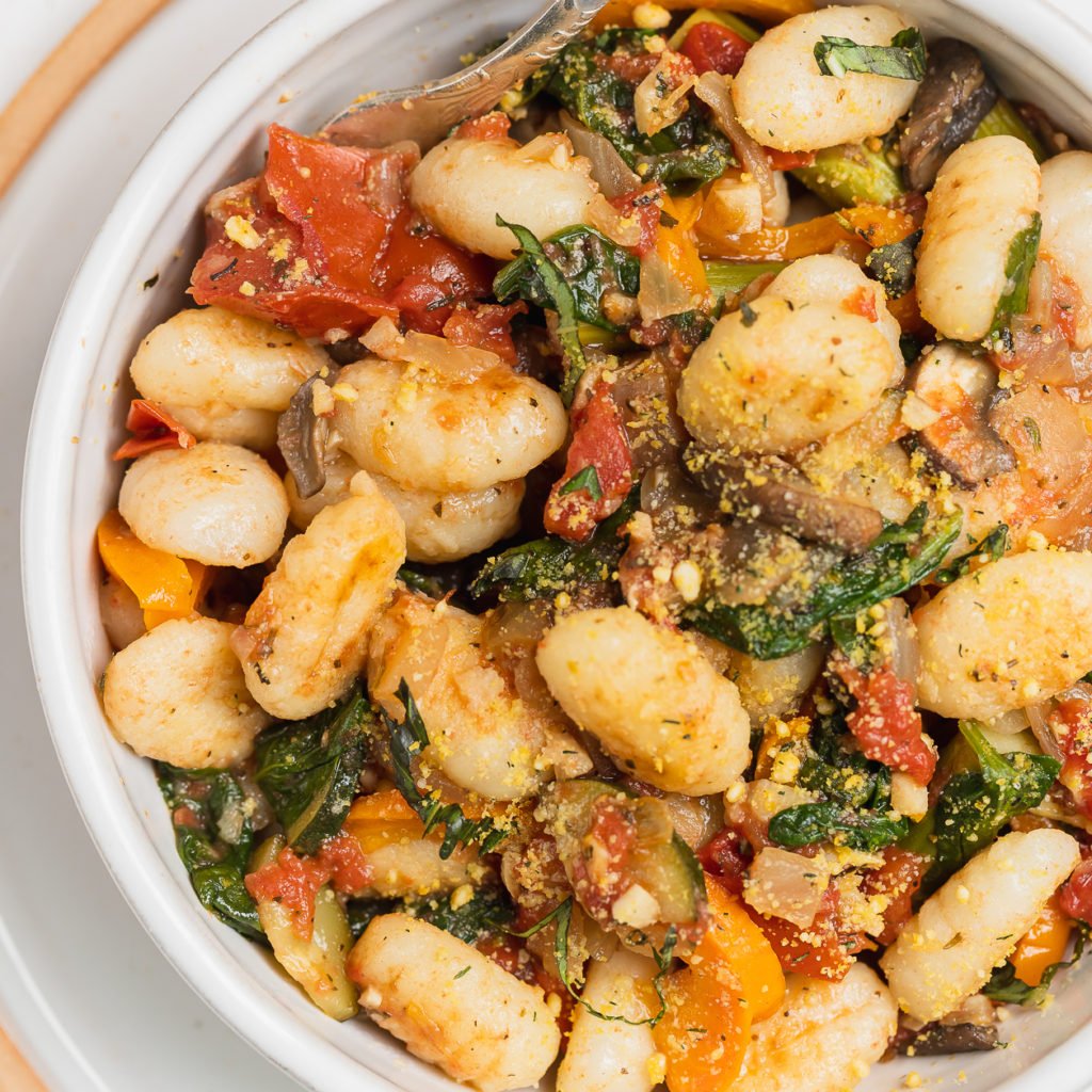 closeup of easy vegetable gnocchi dish in a bowl by sweet simple vegan