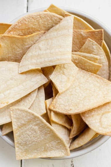 Homemade tortilla chips in a white bowl