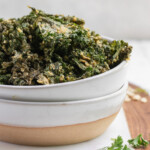 Baked Vegan Ranch Kale Chips up close in a bowl by sweet simple vegan