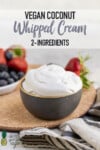 Bowl of fluffy coconut whipped cream next to berries by Sweet Simple Vegan pinterest