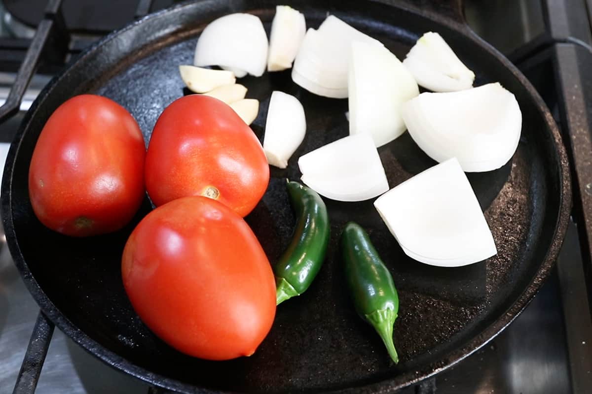 charring vegatables on comal for salsa