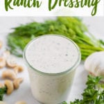 Cashew ranch dressing in a cup surrounded by ingredients by sweet simple vegan for pinterest
