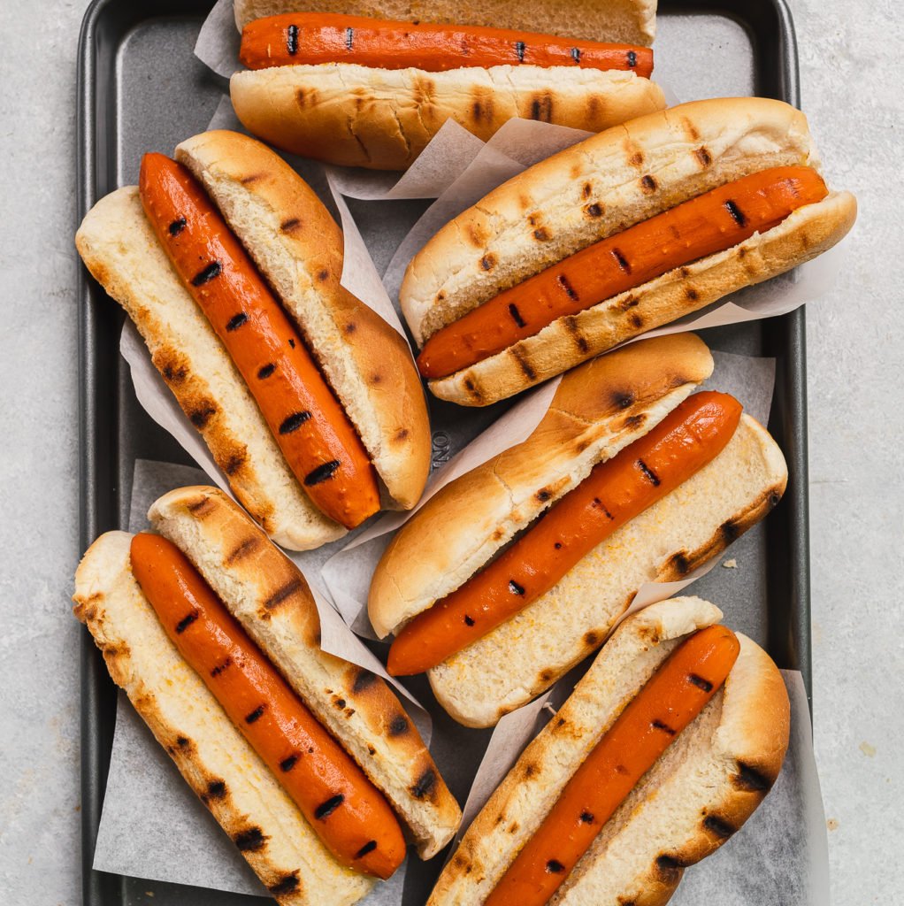 Grilled vegan carrot hot dogs in grilled buns by sweet simple vegan
