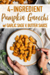 Vegan pumpkin gnocchi with sage butter sauce on a white plate with a fork and vegan parmesan cheese for pinterest