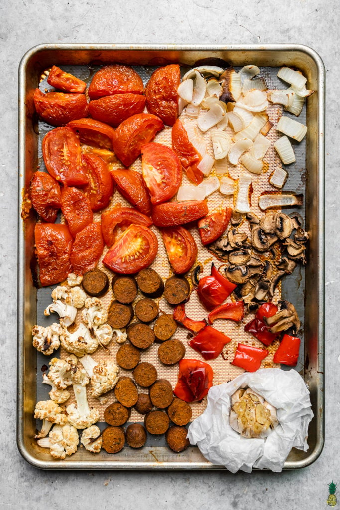 ingredients on a sheet pan to make an easy vegan sheet pan pasta recipe by sweet simple vegan