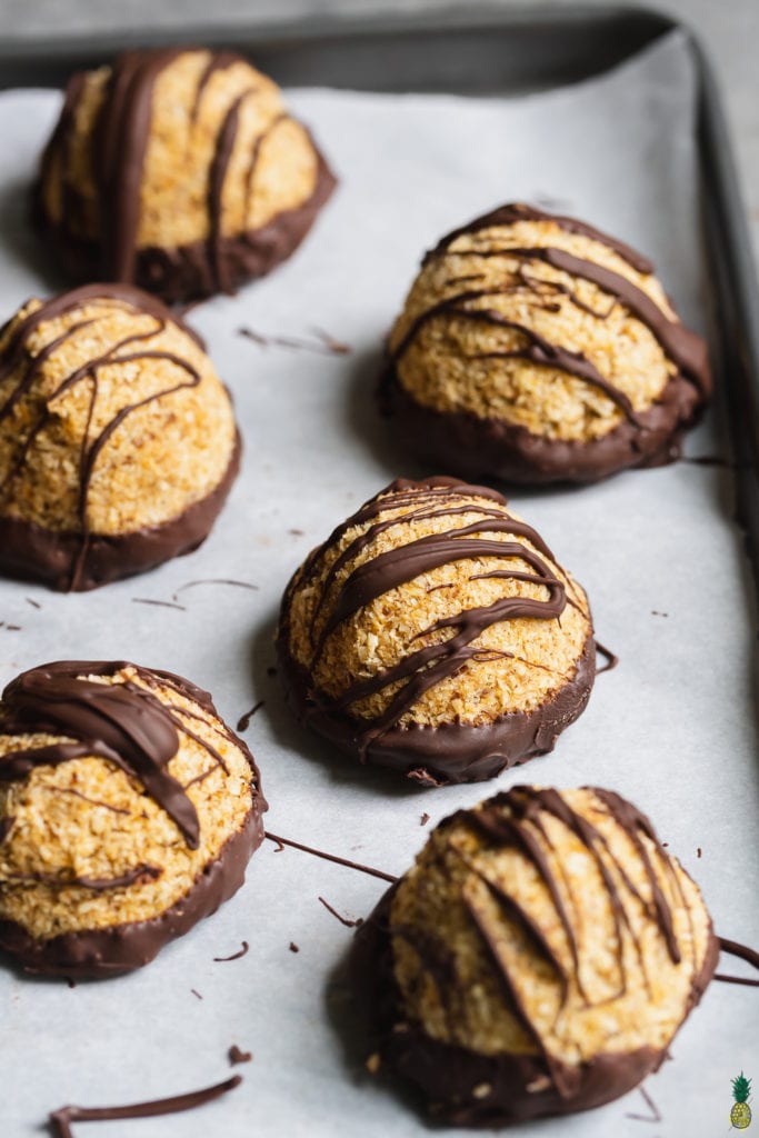 Chocolate Dipped Pumpkin Macaroons on a baking sheet