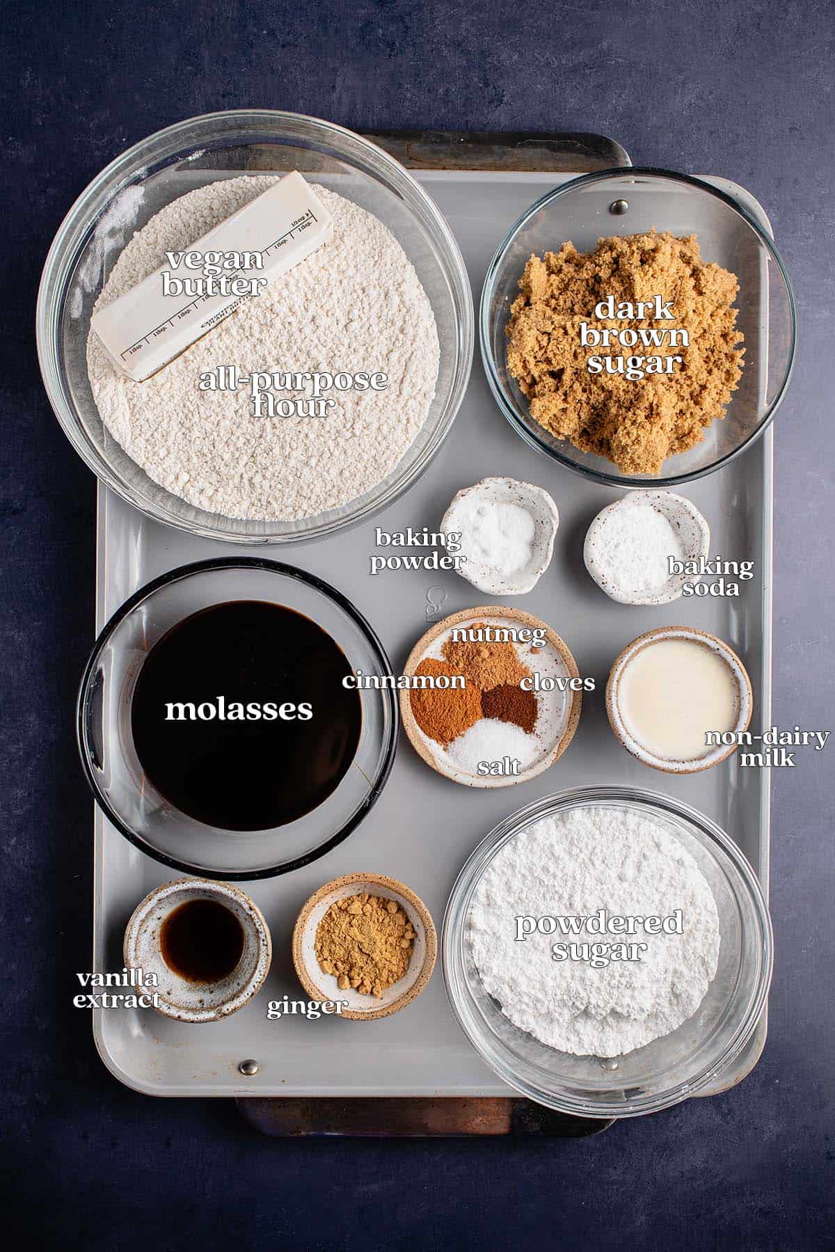 labeled ingredients for vegan gingerbread cookies on baking sheet