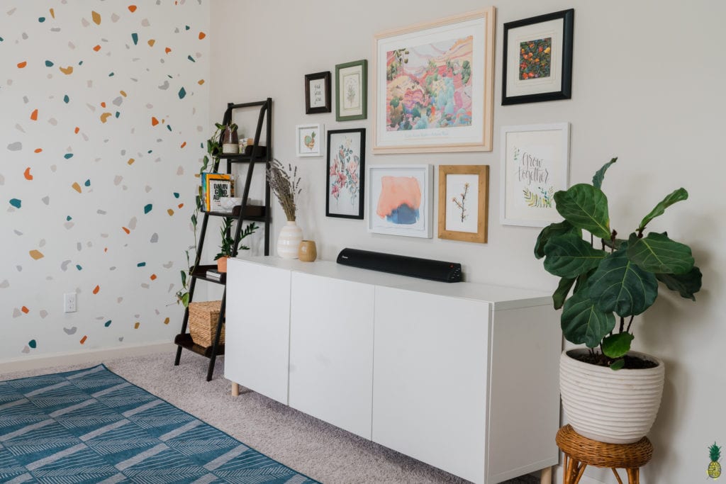 home office with cabinet and shelf with gallery wall. 